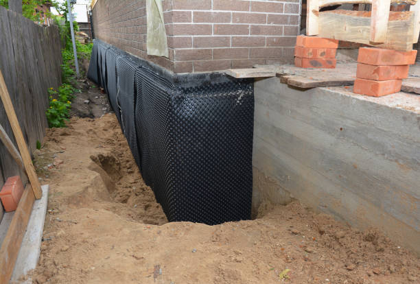 SJ Waterproofing Pros technician performing targeted Basement Waterproofing assessment in Little Falls, NY